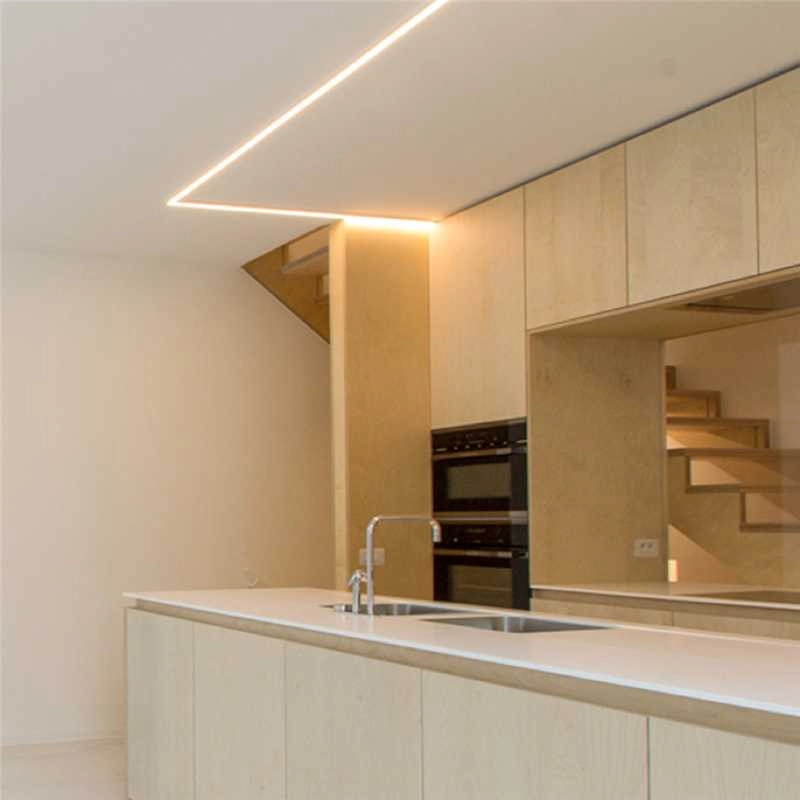Modern interior with recessed linear lighting and finished wall and ceiling surfaces