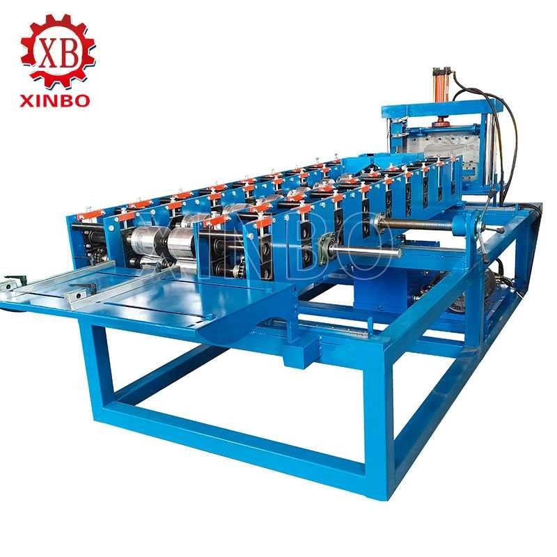 Automatic changeover standing seam roof panel roll forming line