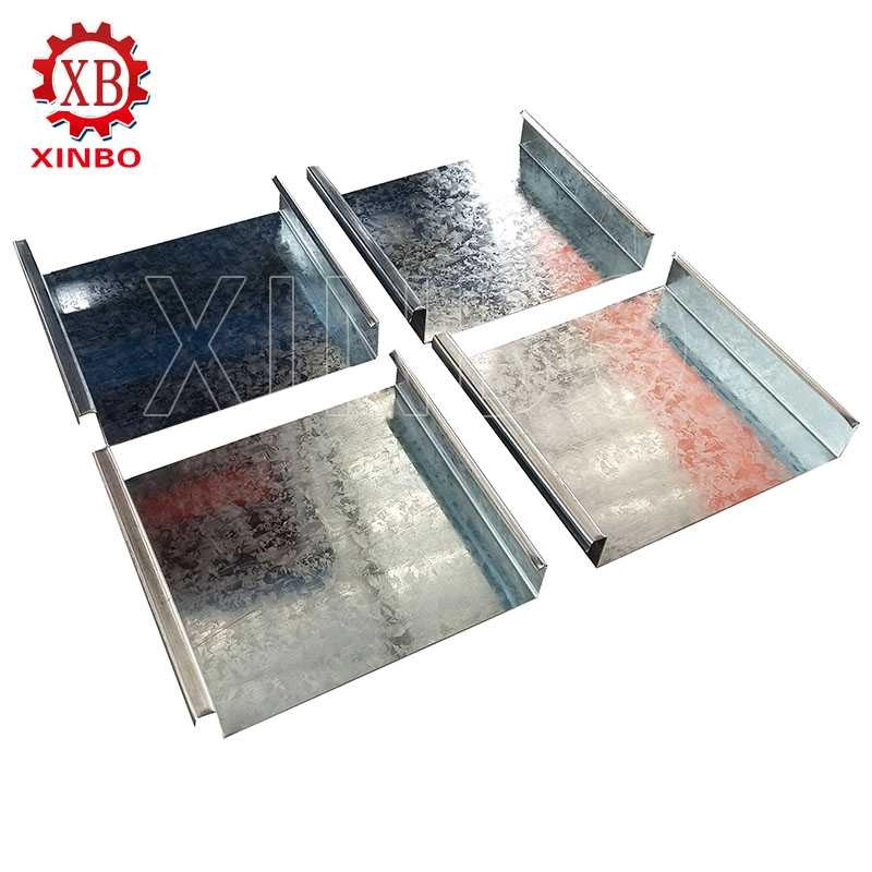 Finished metal roof panels with raised standing seams