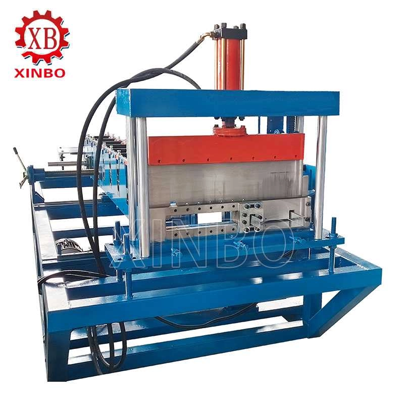 Hydraulic cutting section of a standing seam roof panel roll forming machine