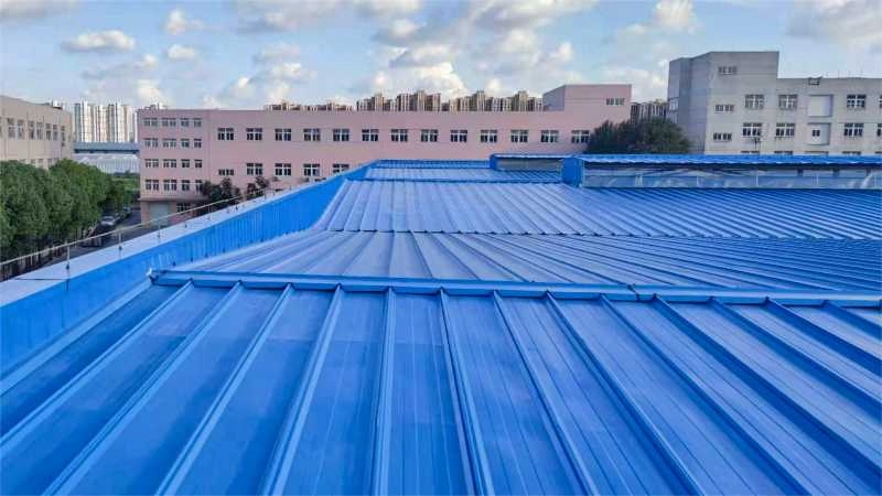 Metal roof panels installed on industrial building roof