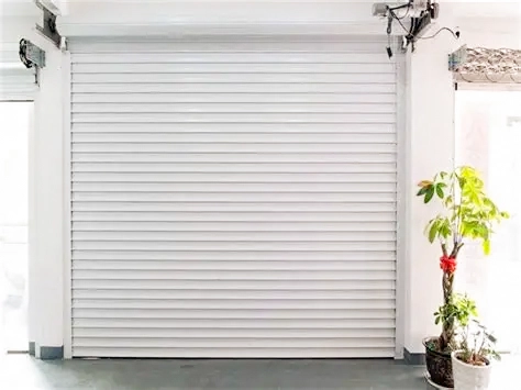 Completed white roller shutter door installed in an indoor entrance