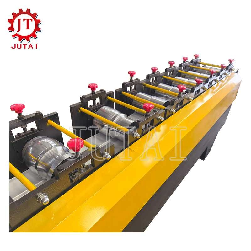 Roll forming stations shaping metal strips for shutter door slats
